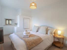 A bedroom with a bed and artwork at 46 North Street, Stoke-Sub-Hamdon, Somerset