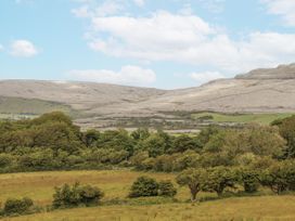 A landscape with hills and trees at Kate's Cottage