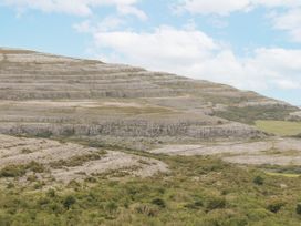A landscape with mountains and rock formations at Kate's Cottage