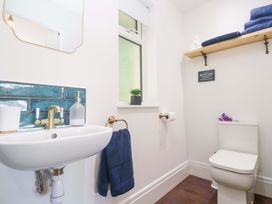 A bathroom with a sink and toilet at Lavender Cottage