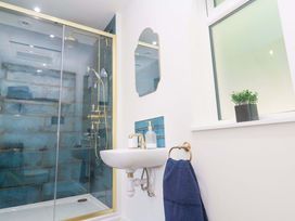 A bathroom with a shower and sink at Lavender Cottage