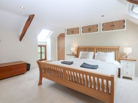 A bedroom with a double bed and nightstands at Ty Newydd in Llanrhychwyn near Llanrwst