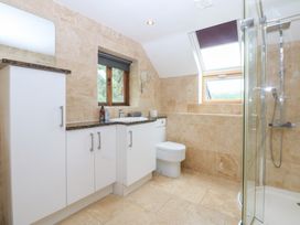 A bathroom with a shower and sink at Ty Newydd Llanrhychwyn near Llanrwst