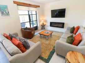 A living room with a sofa and armchair at Just A Cottage St Florence