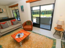 A living room with a sofa and a coffee table at Just A Cottage in St Florence