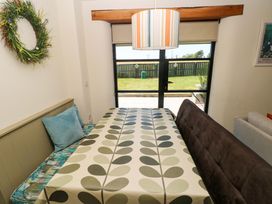 A dining room with a table and chairs at Just A Cottage in St Florence
