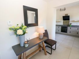 A kitchen with a table and chairs at Just A Cottage in St Florence