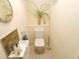 A bathroom with a toilet and sink at Just A Cottage in St Florence