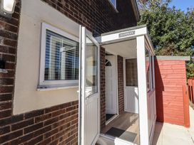An entrance with a front door and window at 3 Longstone Park Beadnell