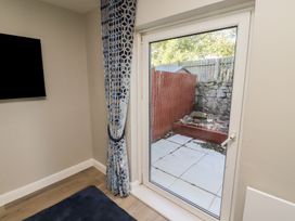 A snug with a door leading to a patio area at 3 Longstone Park Beadnell