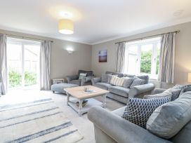 A living room with a coffee table and sofas at Woodlark