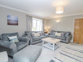 A living room with sofas and a coffee table at Woodlark