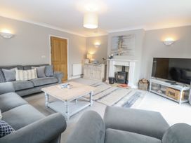 A living room with sofa and coffee table at Woodlark