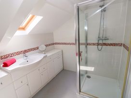 A bathroom with a sink and shower at The Sycamores in Llawhaden near Narberth