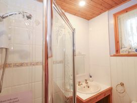 A bathroom with a shower and sink at Pelican Cottage St Ives
