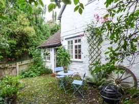 A garden with a table and chairs at The Smithy in Lucton near Mortimers Cross