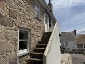 An outdoor staircase leading to a door at Crows Nest in St Ives