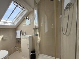 A bathroom with a shower and sink at Crows Nest in St Ives