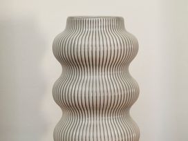 A decorative vase with a wavy design at Apartment 2, 86 Dyer Street Cirencester