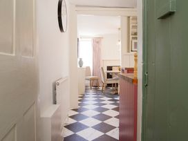 A dining room with a table and chairs at Apartment 2, 86 Dyer Street Cirencester