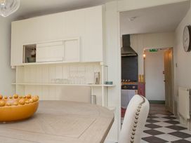 A dining room with a table and chairs at Apartment 2, 86 Dyer Street, Cirencester