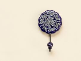 A decorative hook on a wall at Apartment 2, 86 Dyer Street Cirencester