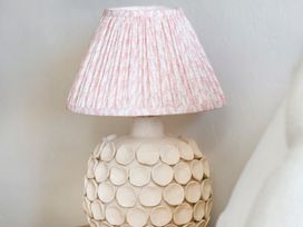 A lamp with a patterned shade