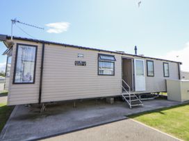 A caravan with windows and a door at V9 Ty Mawr Holiday Park