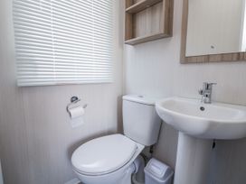 A bathroom with a sink and toilet at V9 Ty Mawr Holiday Park