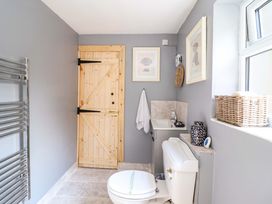 A bathroom with a sink and toilet at Bwthynbach in Porthmadog