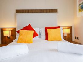 A bedroom with a bed and pillows at The Maples 44 St. Austell