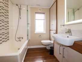 A bathroom with a bathtub and sink at The Maples 44 St. Austell