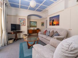 A living room with a sofa and television at Sandy Shore in Bridlington