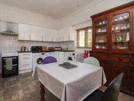 A kitchen with a table and chairs at Sandy Shore in Bridlington