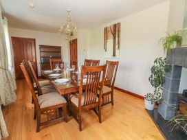 A dining room with a table and chairs at Ash House Ballyvaughan