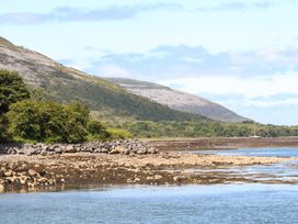 A scenic view of a mountain and water at Ash House Ballyvaughan