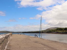 A pier with a sailboat at Ash House in Ballyvaughan