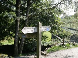 A signpost indicating directions to Grasmere and Ambleside in Troutbeck Bridge near Windermere
