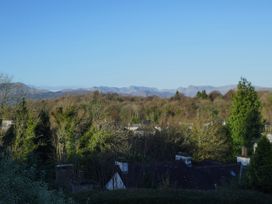A view of mountains and trees from the property at School Cottage, Troutbeck Bridge near Windermere