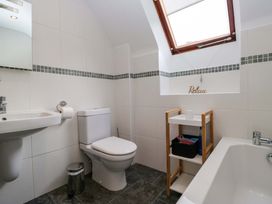 A bathroom with a toilet and a sink at School Cottage in Troutbeck Bridge near Windermere