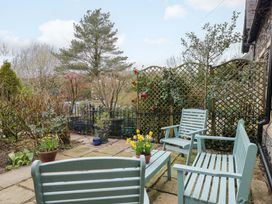 A garden with seating and plants at School Cottage in Troutbeck Bridge near Windermere