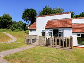 A bungalow with a deck and garden area at Boo’s Bungalow in Callington near Gunnislake