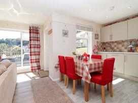 A dining room with a table and chairs at Boo’s Bungalow in Callington near Gunnislake