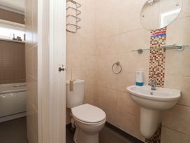 A bathroom with a toilet and sink at Boo’s Bungalow in Callington near Gunnislake