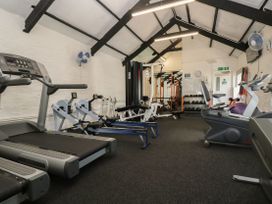 A gym with treadmills, exercise equipment and weights at Boo’s Bungalow in Callington near Gunnislake