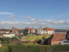 A view of houses and grass with a road in Bridlington