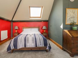 A bedroom with a bed and nightstands at Atelier in Bridlington