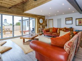 A living room with a sofa and coffee table at Gowan Brae in Criccieth