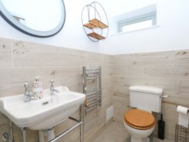 A bathroom with a sink and toilet at Gowan Brae in Criccieth