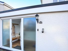 An entrance with a door and coat hooks at Penrhos Walks Holyhead